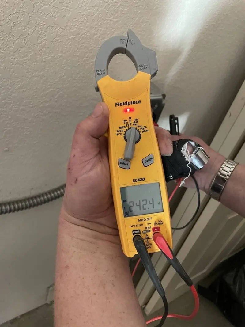 Voltage testing with clamp meter during Whole House Surge Protector in La Vergne